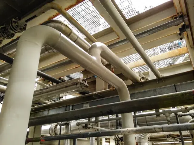 Corroded pipework in an offshore oil and gas facility coated with NanoPrep and PPG PSX 700